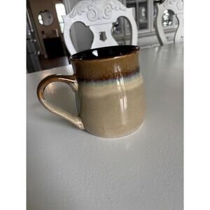 This is a ceramic coffee mug, from Boston Warehouse Trading Corp art pottery
